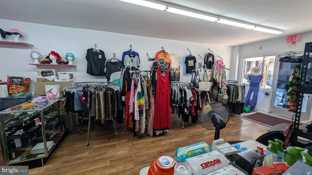 a view of a storage area with clothes and shoes