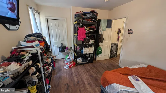 a bedroom with a bed and a closet