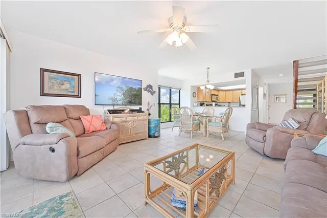 a view of a chairs and table in patio