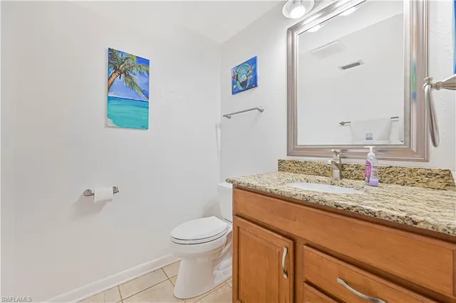 a white refrigerator freezer sitting inside of a kitchen