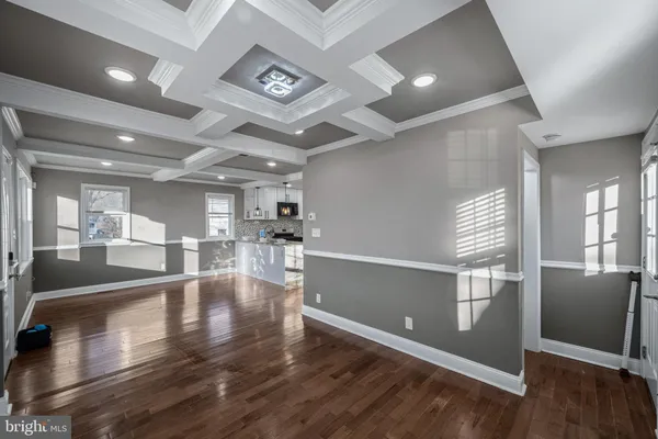 a view of a living room and hardwood floor