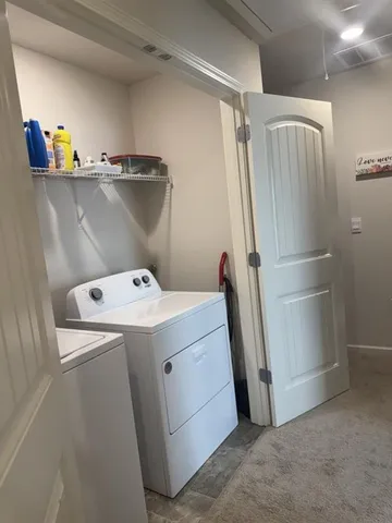 a view of a house with a small yard and plants