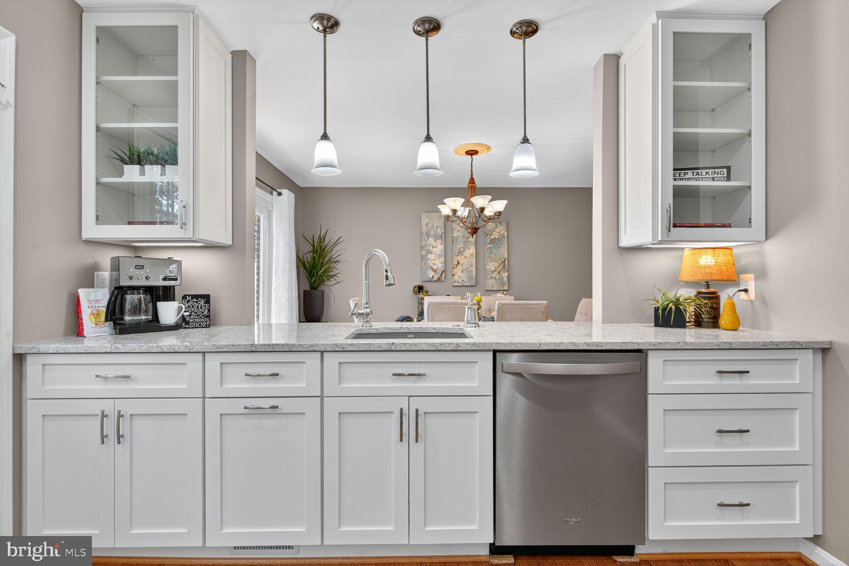5944 Queenston Street Springfield, VA 22152 - Photo 11 of 60 a kitchen with white cabinets and window