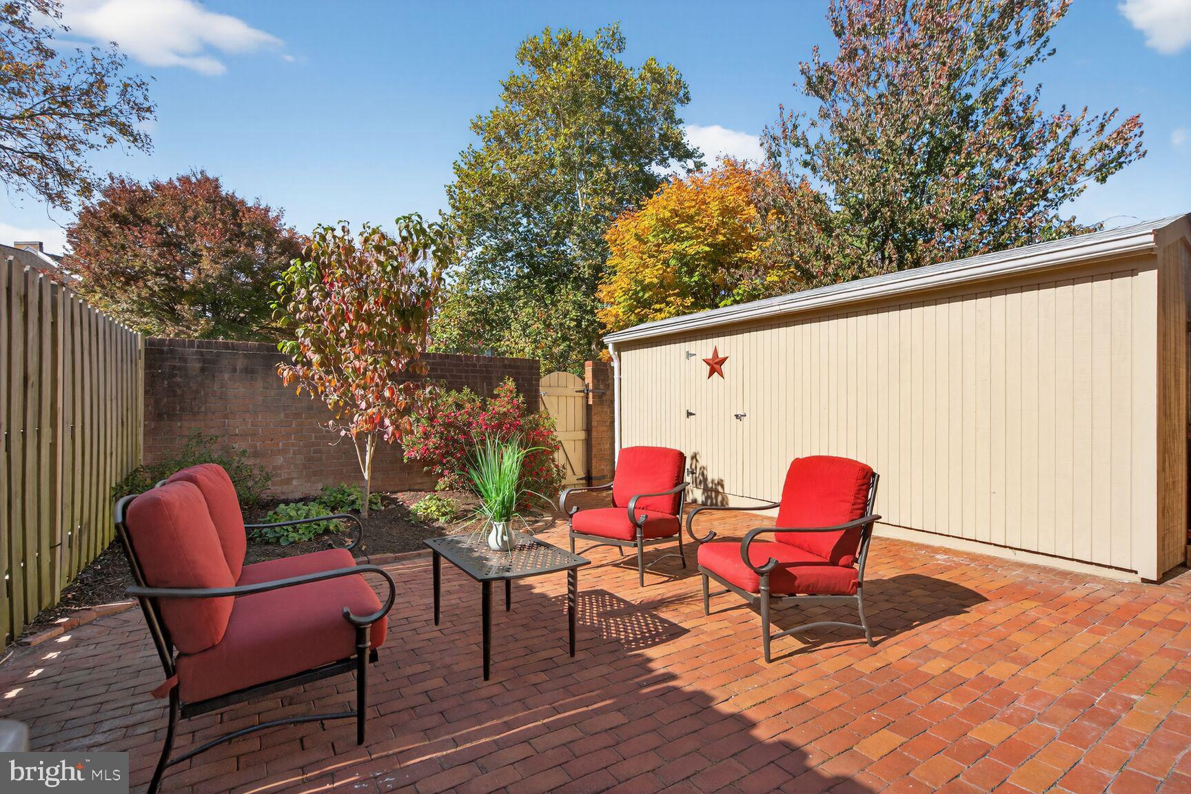 5944 Queenston Street Springfield, VA 22152 - Photo 13 of 60 a backyard of a house with table and chairs