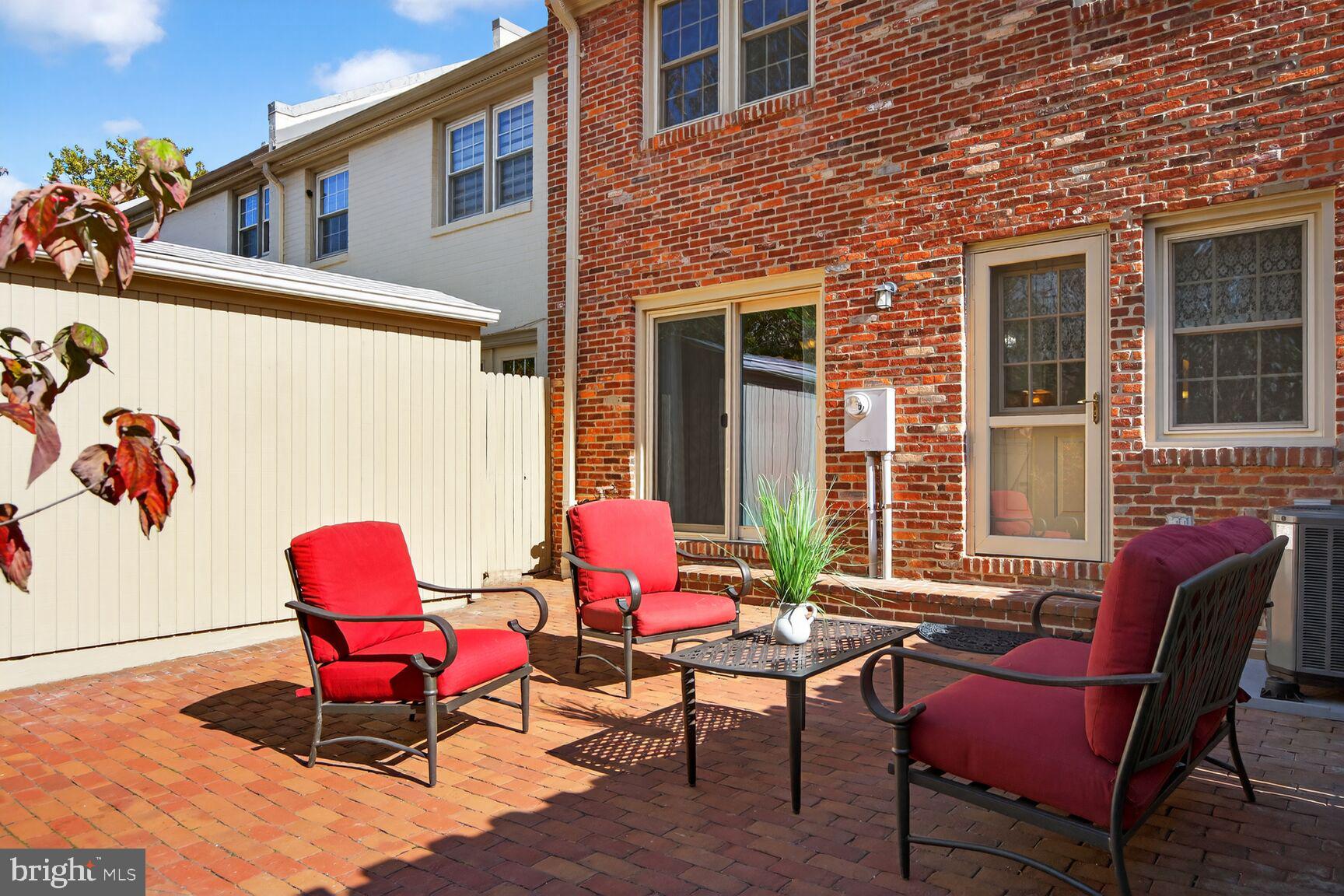5944 Queenston Street Springfield, VA 22152 - Photo 15 of 60 a patio with patio couch and a dining space
