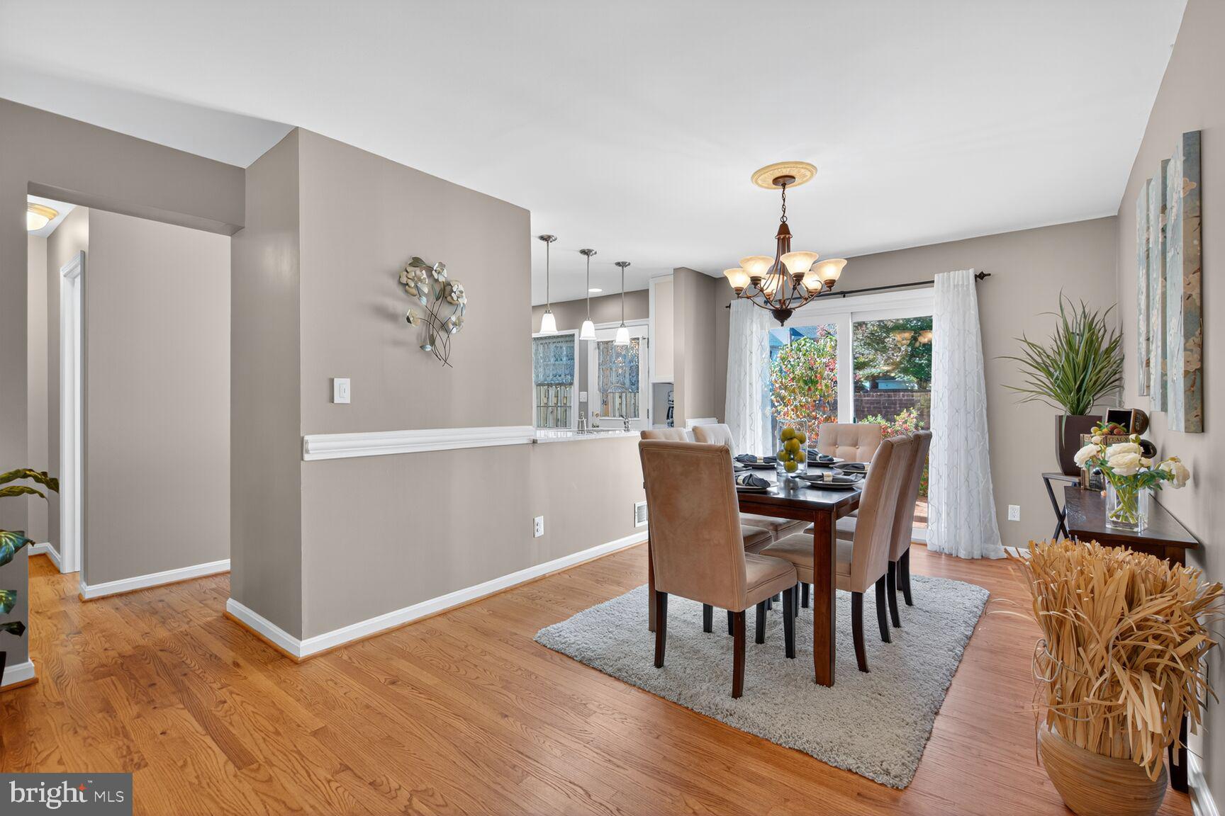 5944 Queenston Street Springfield, VA 22152 - Photo 19 of 60 a view of a dining room with furniture and chandelier