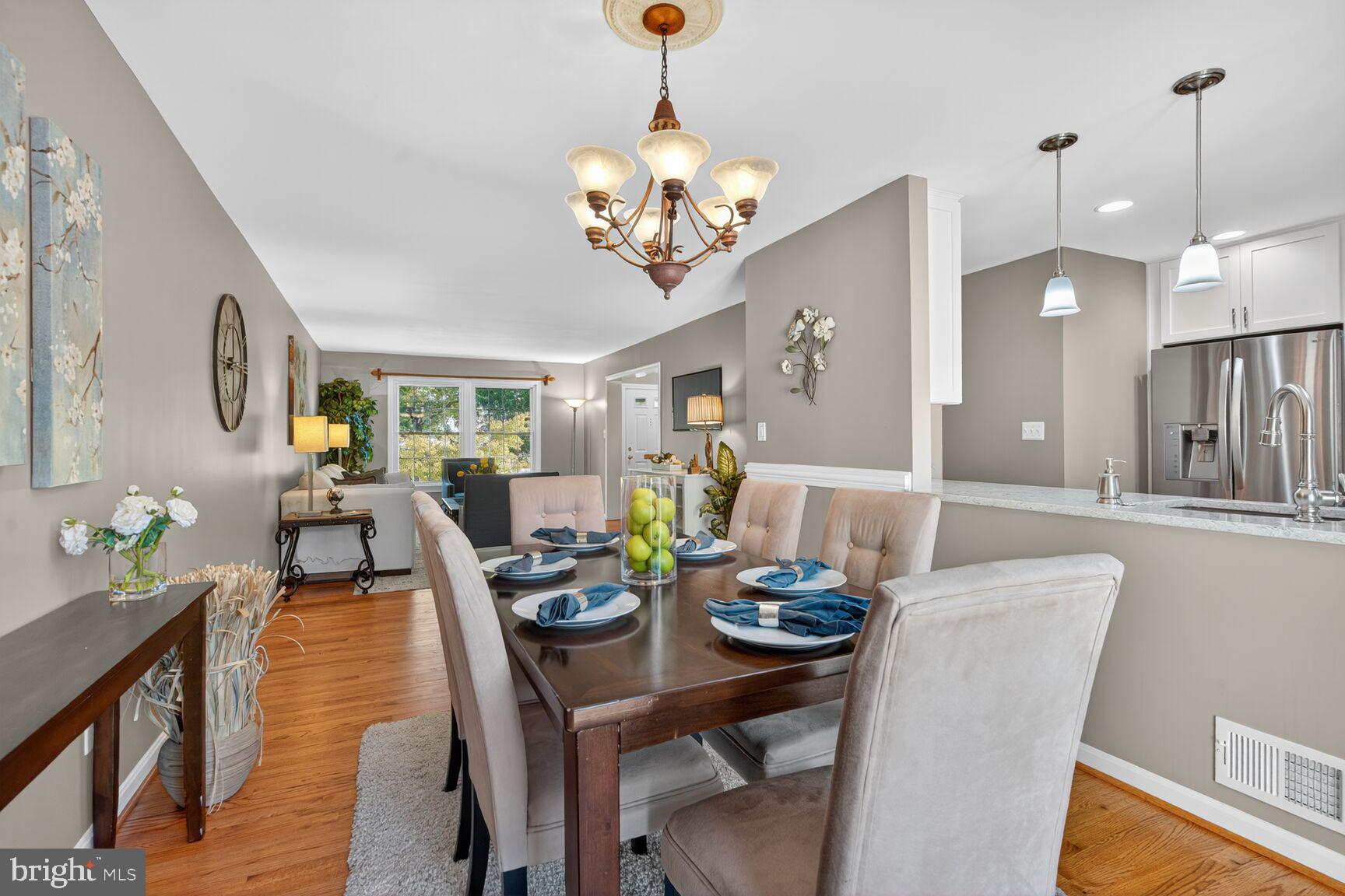 5944 Queenston Street Springfield, VA 22152 - Photo 21 of 60 a view of a dining room with furniture and wooden floor