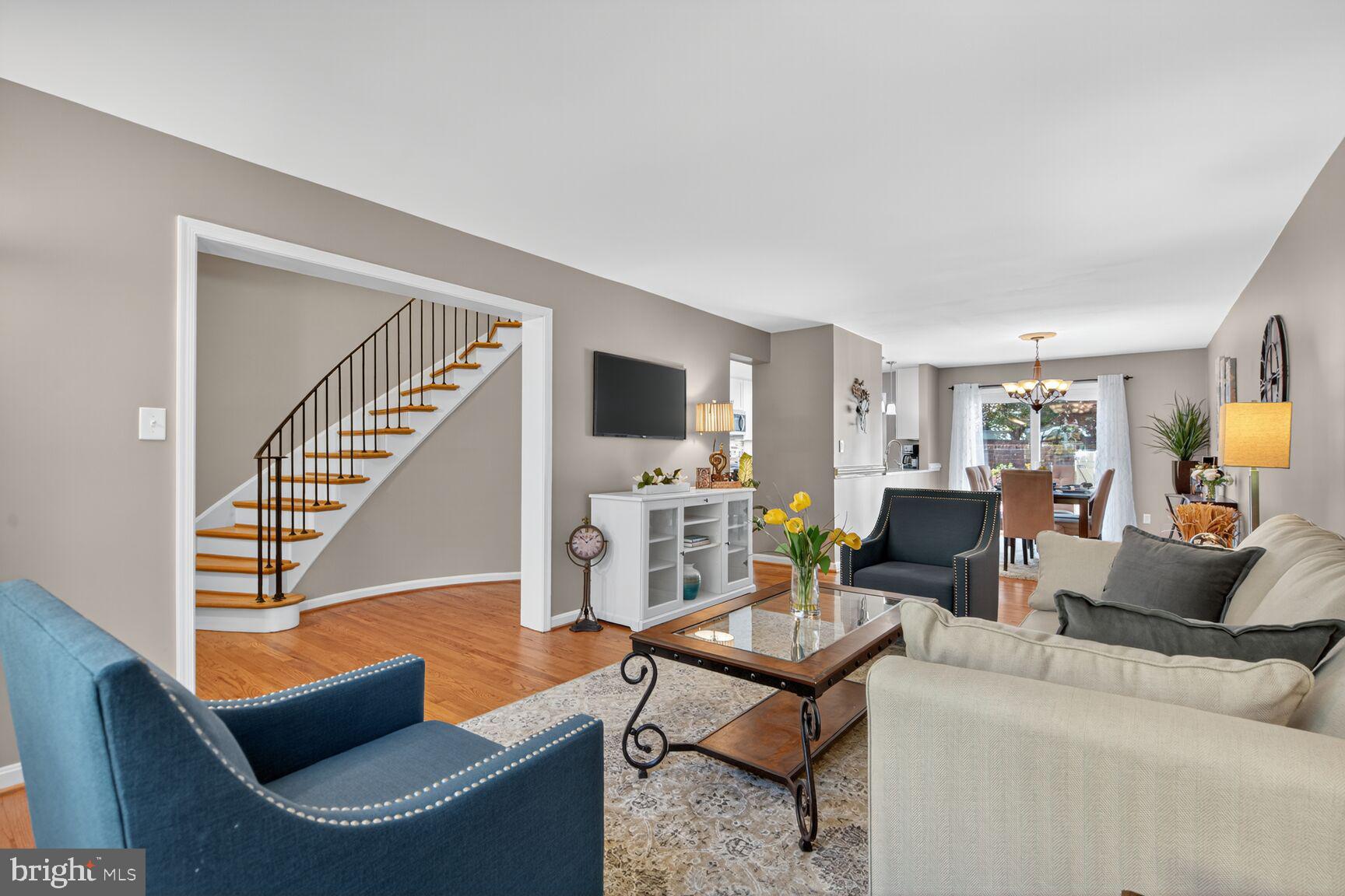 5944 Queenston Street Springfield, VA 22152 - Photo 23 of 60 a living room with furniture and a wooden floor