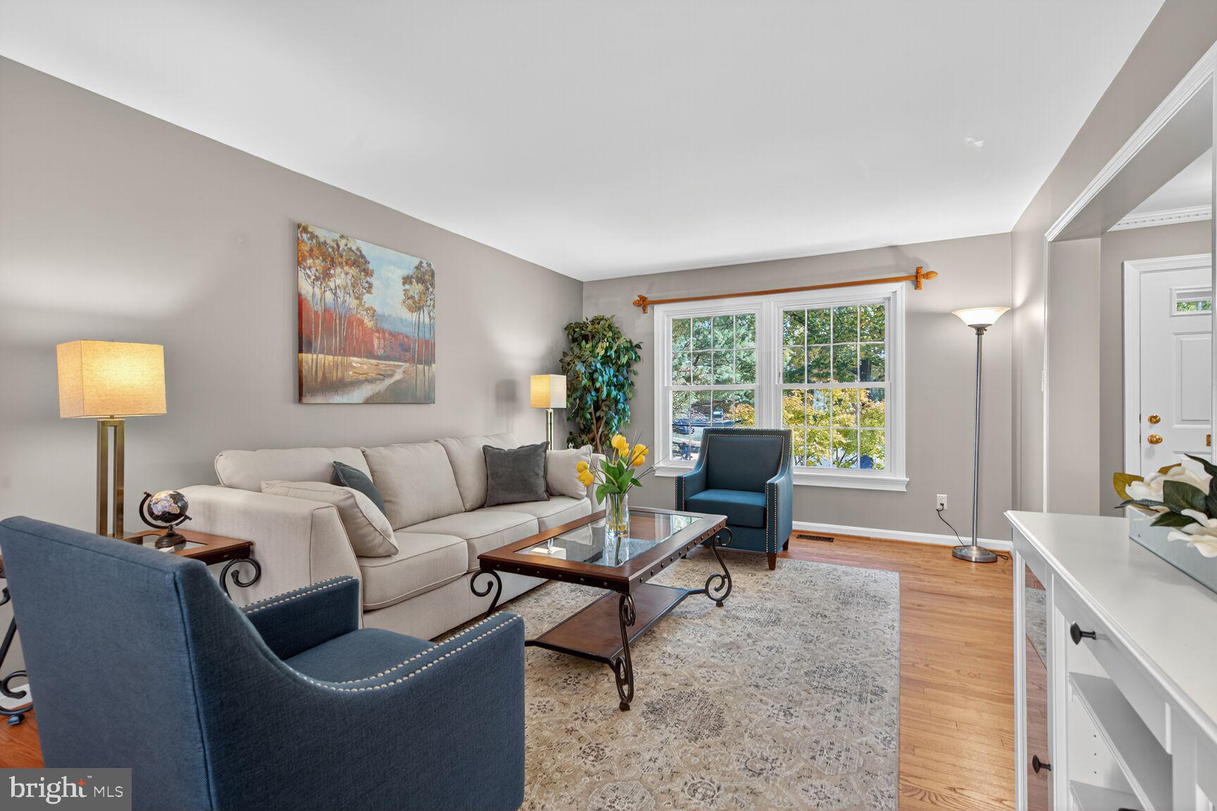 5944 Queenston Street Springfield, VA 22152 - Photo 24 of 60 a living room with furniture and a lamp