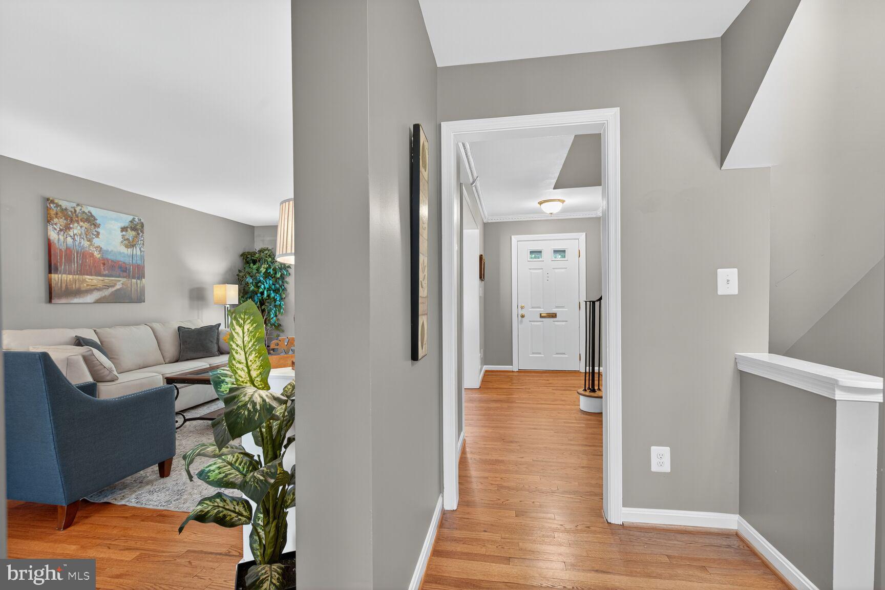 5944 Queenston Street Springfield, VA 22152 - Photo 26 of 60 a living room with furniture and a hallway