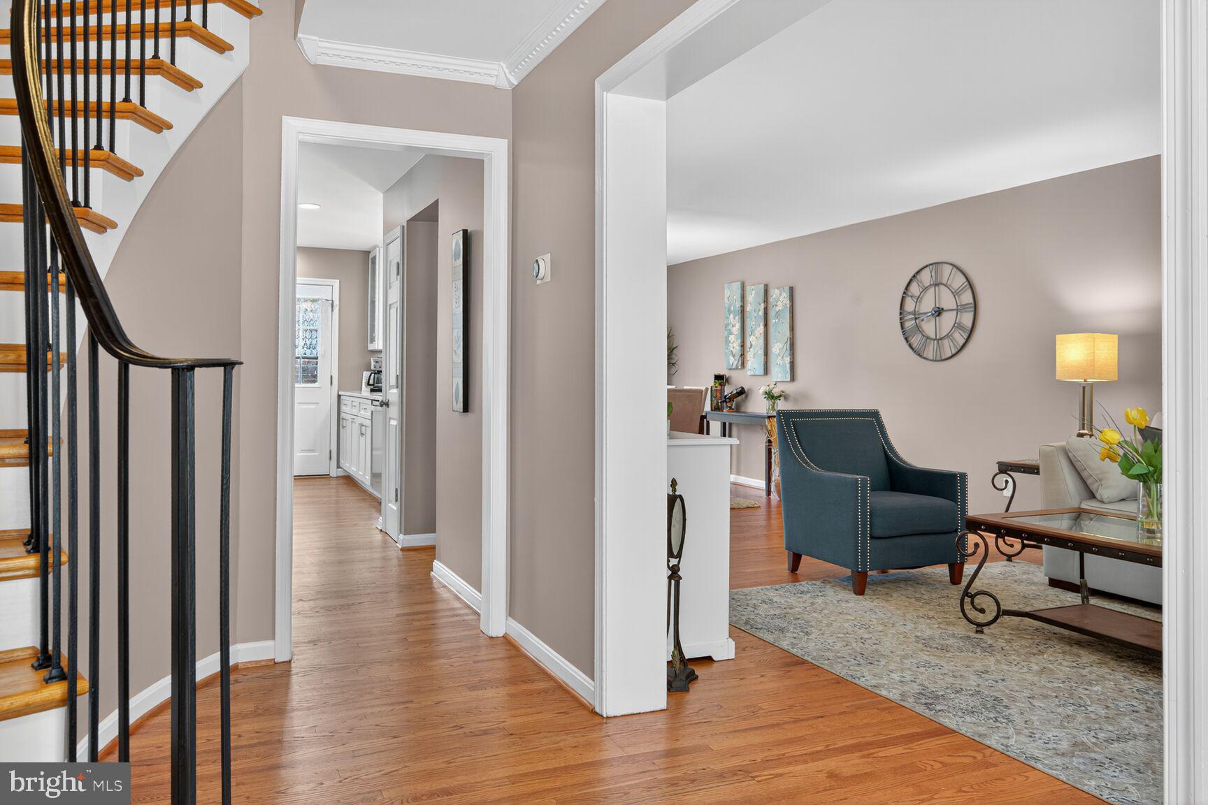 5944 Queenston Street Springfield, VA 22152 - Photo 29 of 60 a view of a hallway with furniture and wooden floor