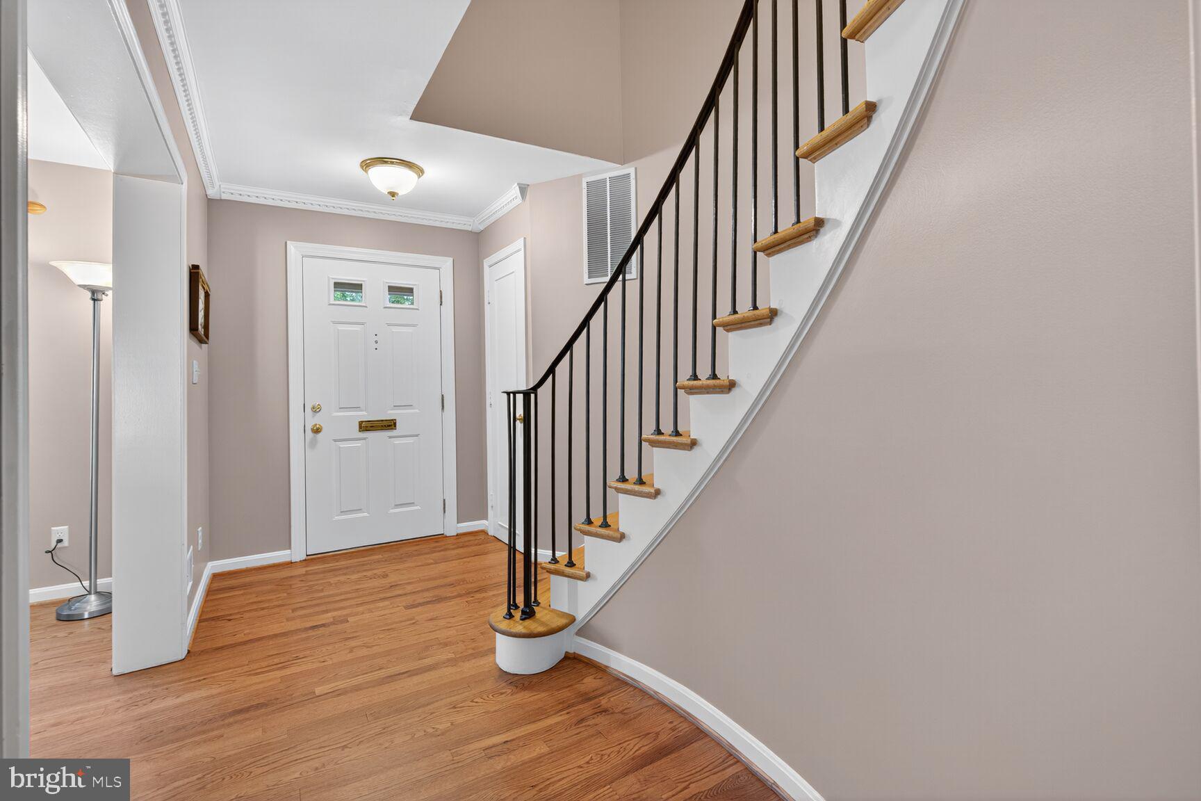 5944 Queenston Street Springfield, VA 22152 - Photo 30 of 60 a view of an entryway with wooden floor