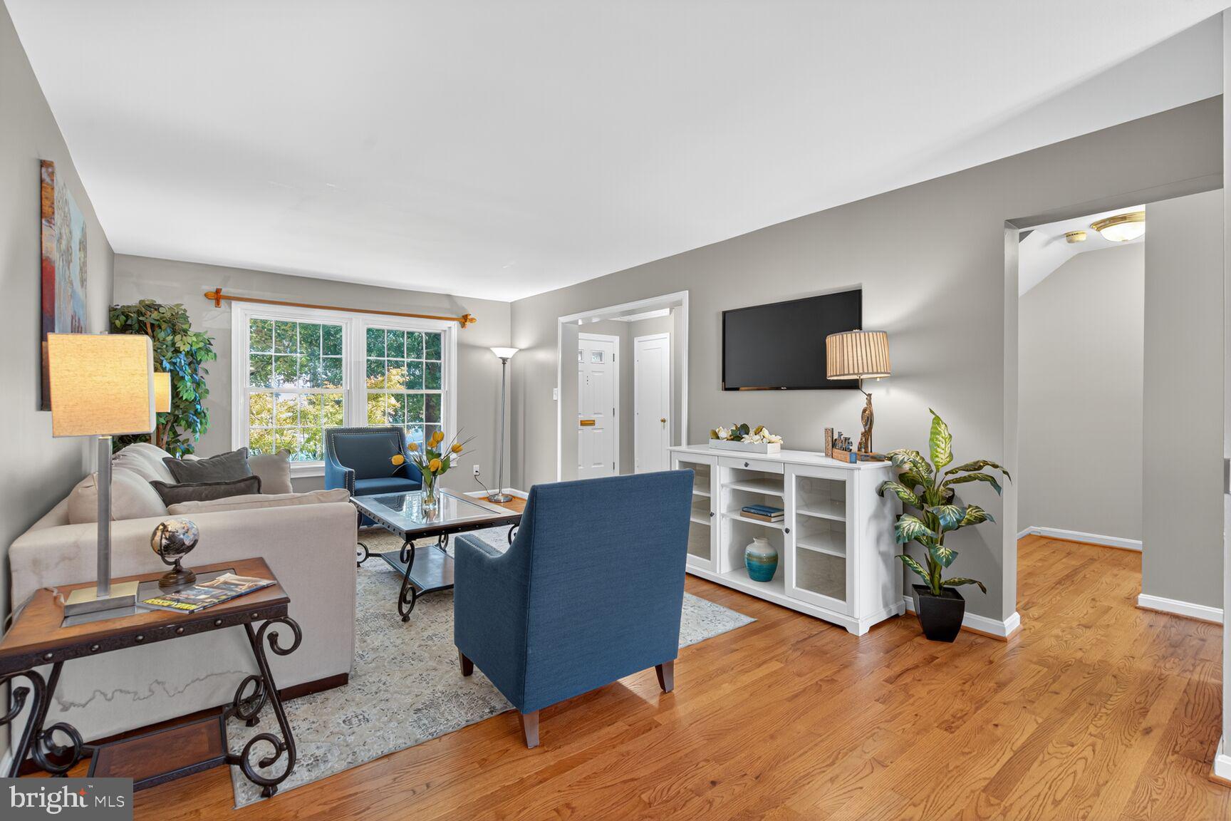 5944 Queenston Street Springfield, VA 22152 - Photo 3 of 60 a living room with furniture and a flat screen tv