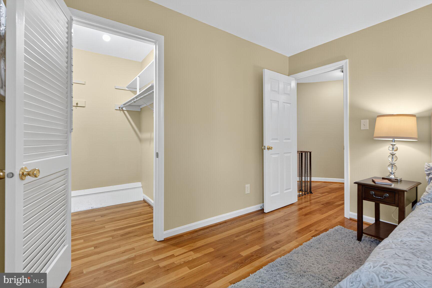 5944 Queenston Street Springfield, VA 22152 - Photo 34 of 60 a view of a room with wooden floor cabinet and mirror