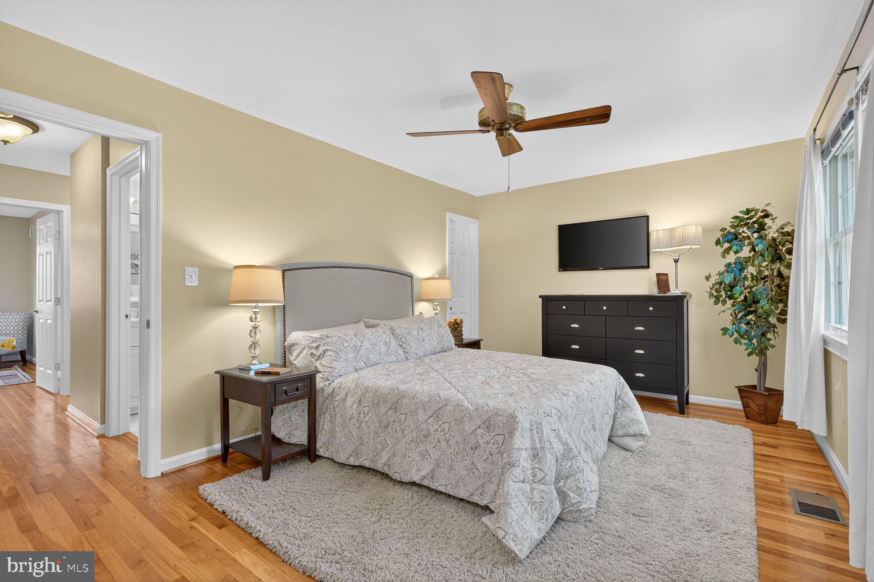 5944 Queenston Street Springfield, VA 22152 - Photo 36 of 60 a bedroom with a bed and a flat screen tv