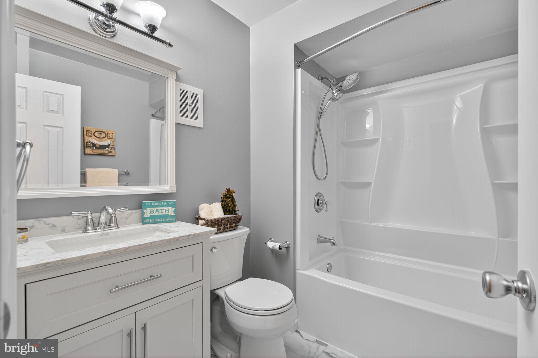 5944 Queenston Street Springfield, VA 22152 - Photo 37 of 60 a bathroom with a sink toilet and shower