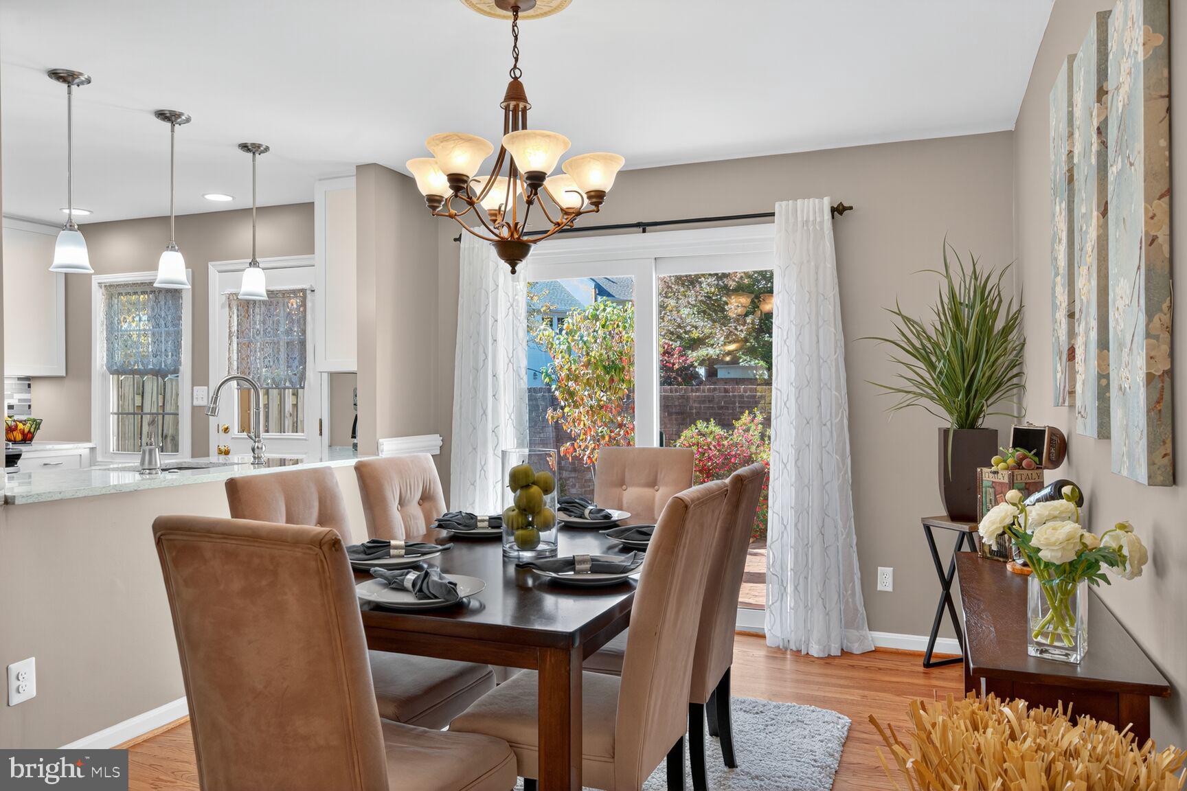 5944 Queenston Street Springfield, VA 22152 - Photo 4 of 60 a view of a dining room with furniture window and wooden floor