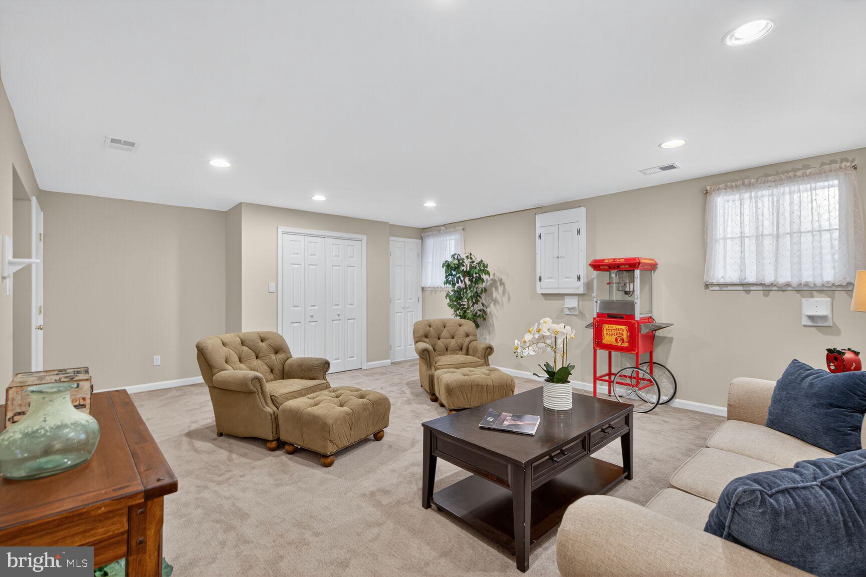 5944 Queenston Street Springfield, VA 22152 - Photo 43 of 60 a living room with furniture and a wooden floor