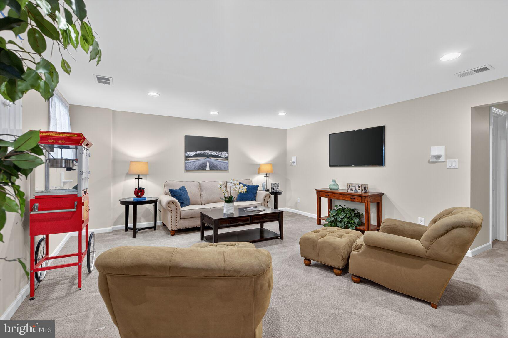 5944 Queenston Street Springfield, VA 22152 - Photo 44 of 60 a living room with furniture fireplace and flat screen tv