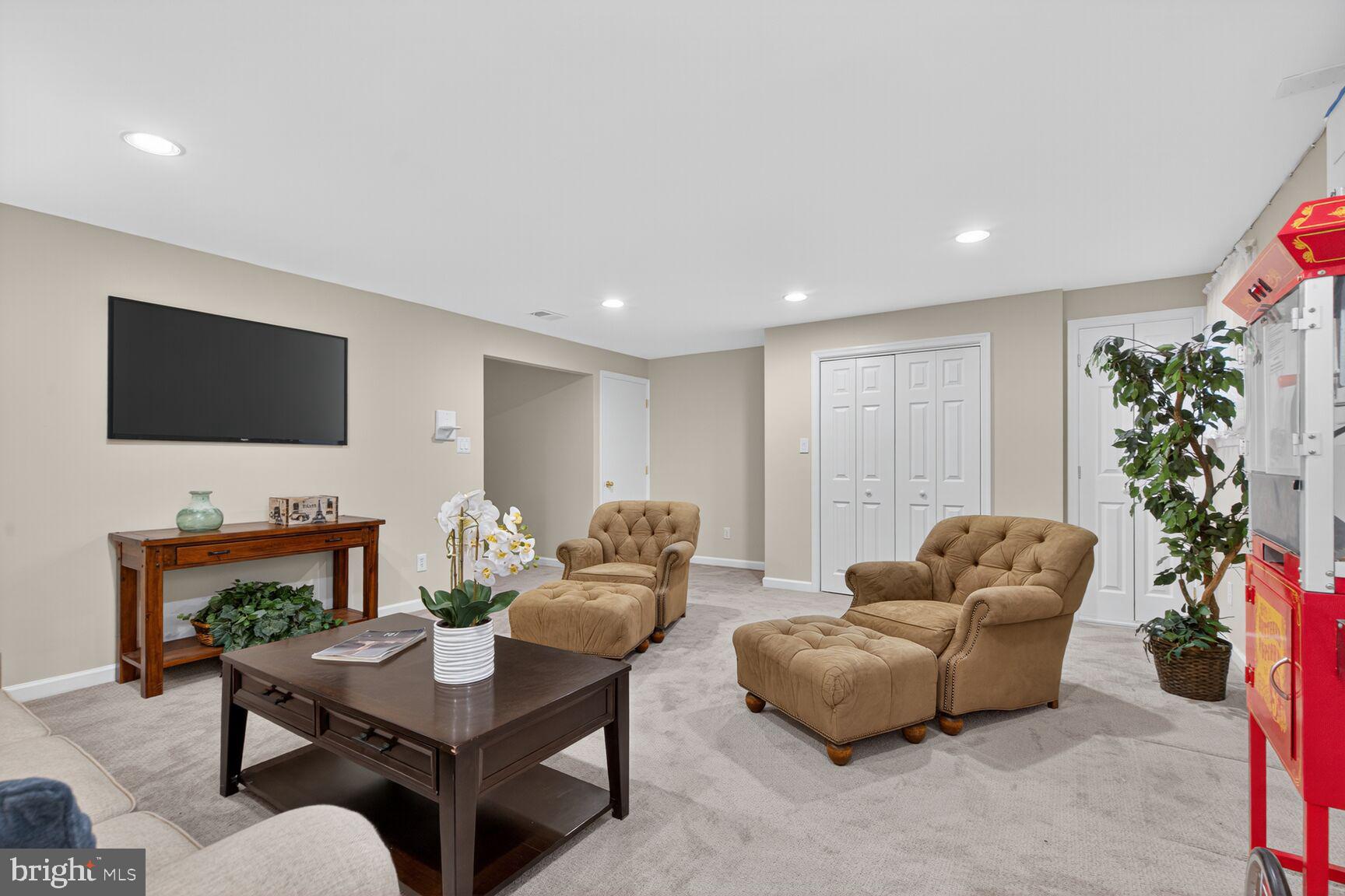 5944 Queenston Street Springfield, VA 22152 - Photo 45 of 60 a living room with furniture and a flat screen tv