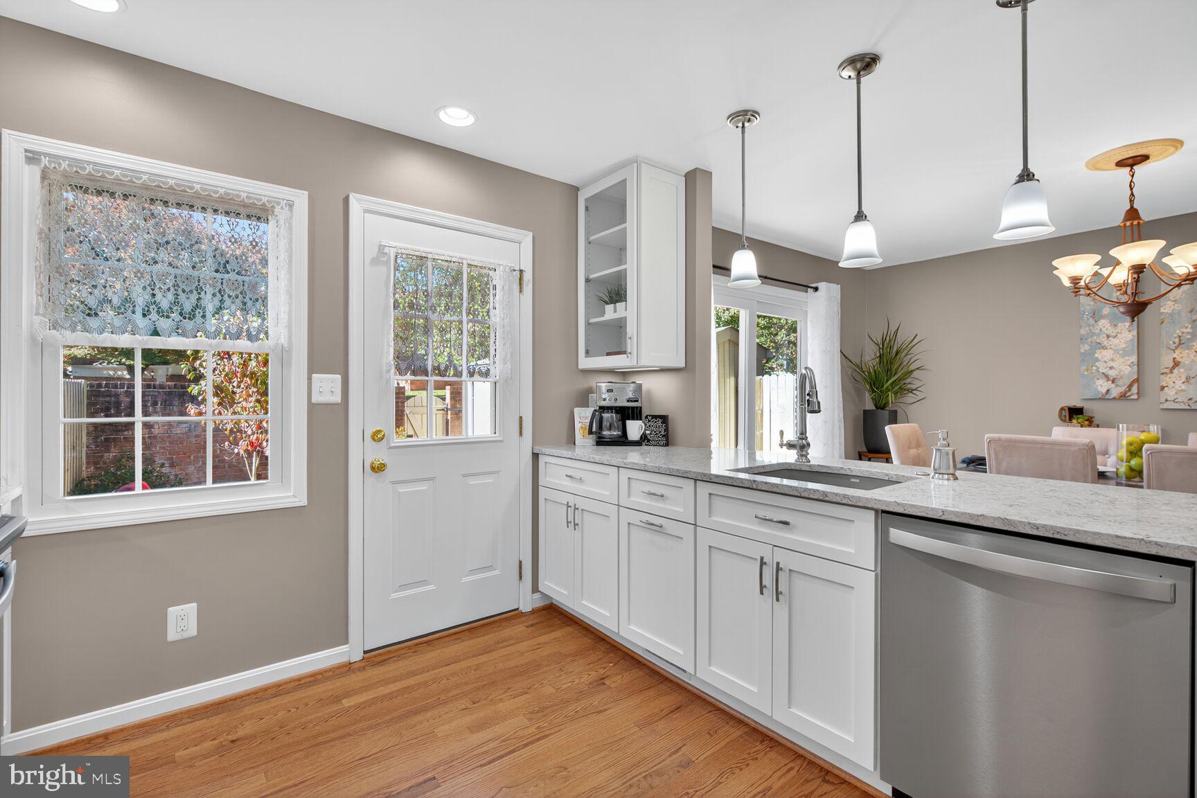 5944 Queenston Street Springfield, VA 22152 - Photo 8 of 60 a kitchen with a white wooden cabinets and white appliances