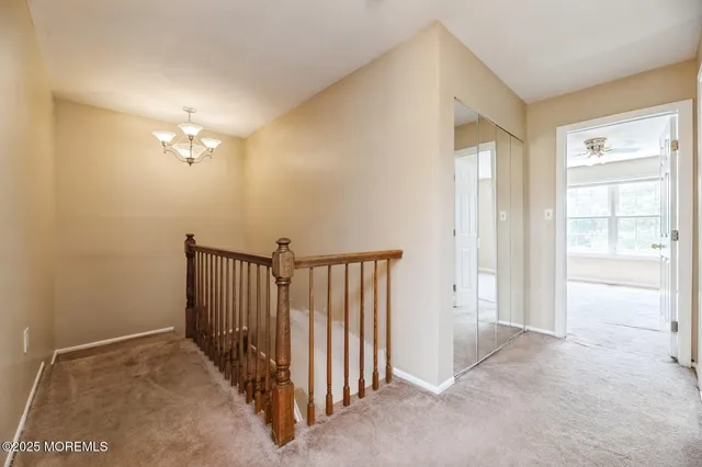 a view of a hallway with closet area