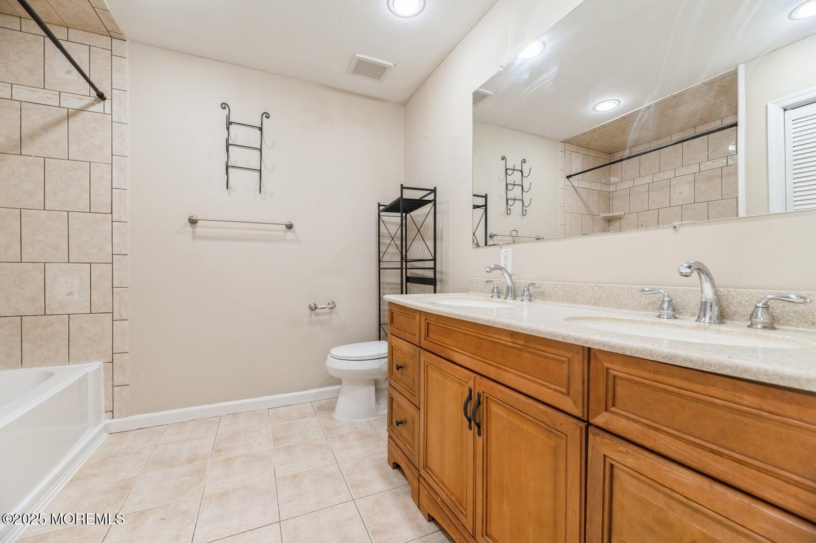 7 Sloop Square Freehold, NJ 07728 - Photo 20 of 30 a spacious bathroom with a granite countertop sink mirror and toilet
