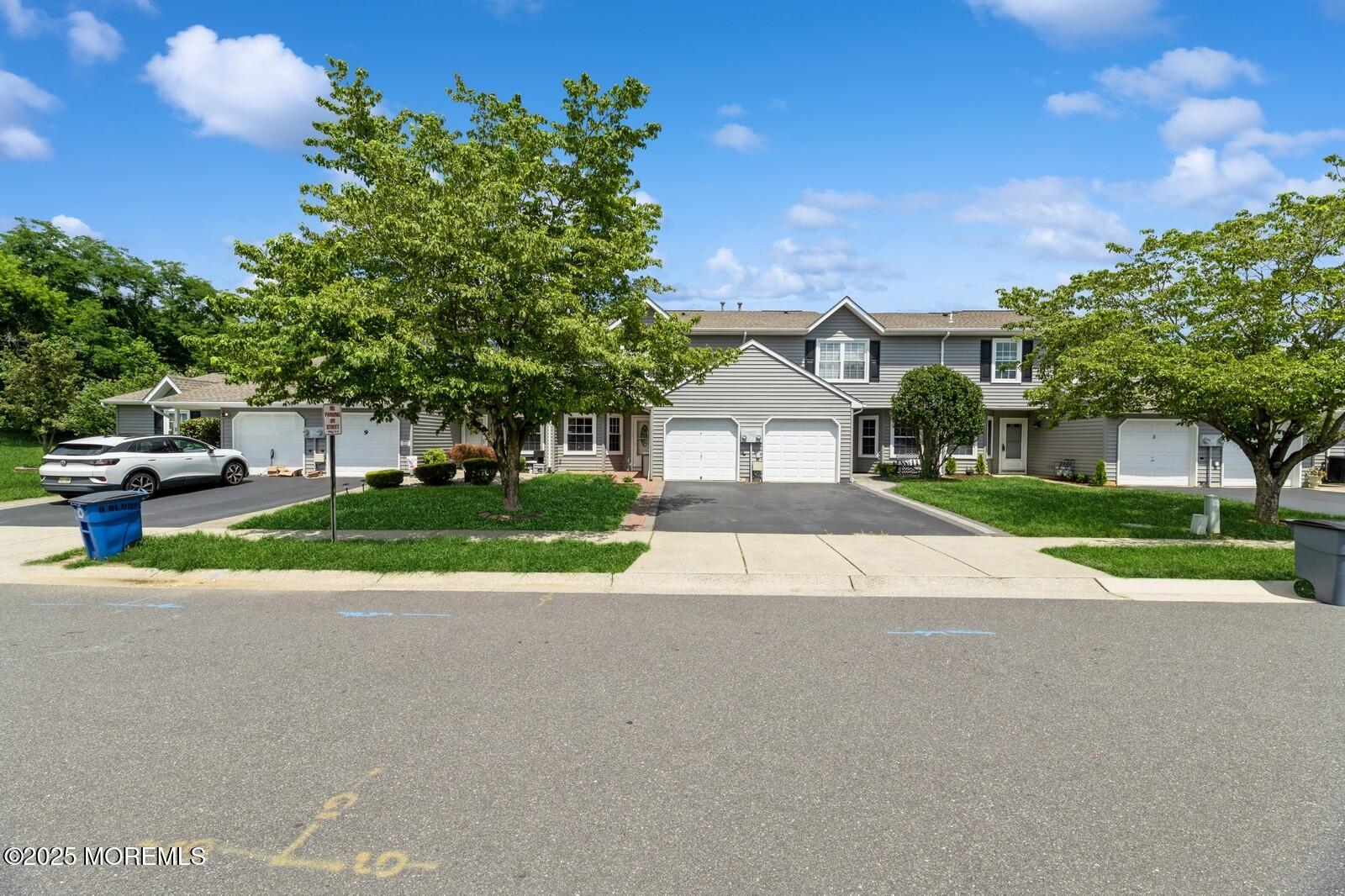 7 Sloop Square Freehold, NJ 07728 - Photo 2 of 30 a view of road with entryway and trees