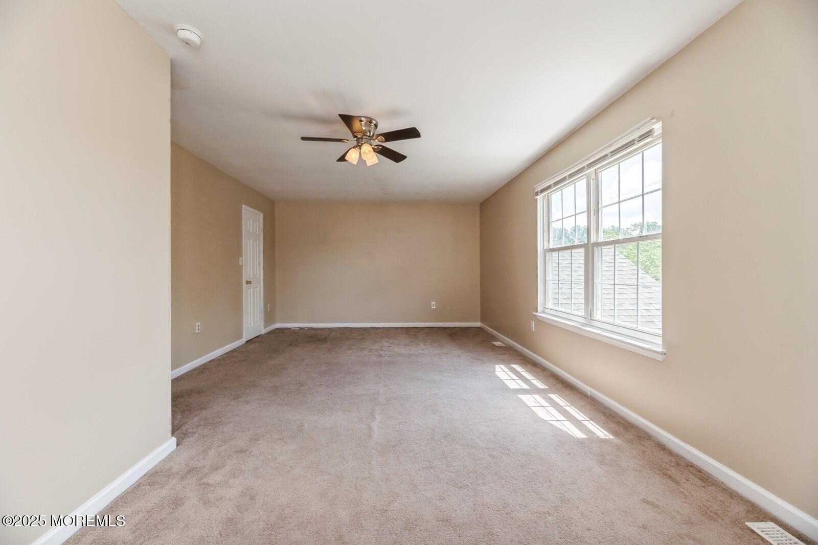 7 Sloop Square Freehold, NJ 07728 - Photo 24 of 30 a view of an empty room with a window