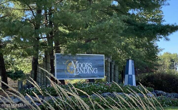 7 Sloop Square Freehold, NJ 07728 - Photo 27 of 30 a sign on the side of a building