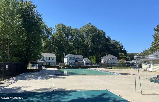7 Sloop Square Freehold, NJ 07728 - Photo 30 of 30 a view of yard along with house and car parked