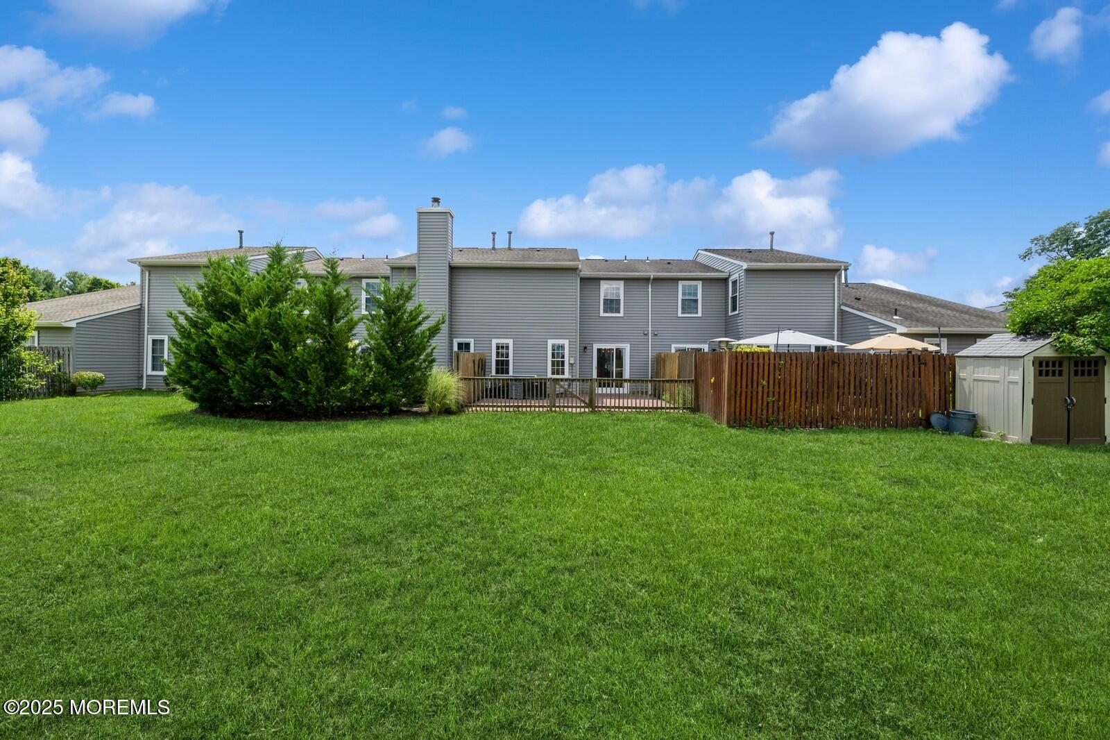 7 Sloop Square Freehold, NJ 07728 - Photo 3 of 30 a view of a house with backyard and a tree