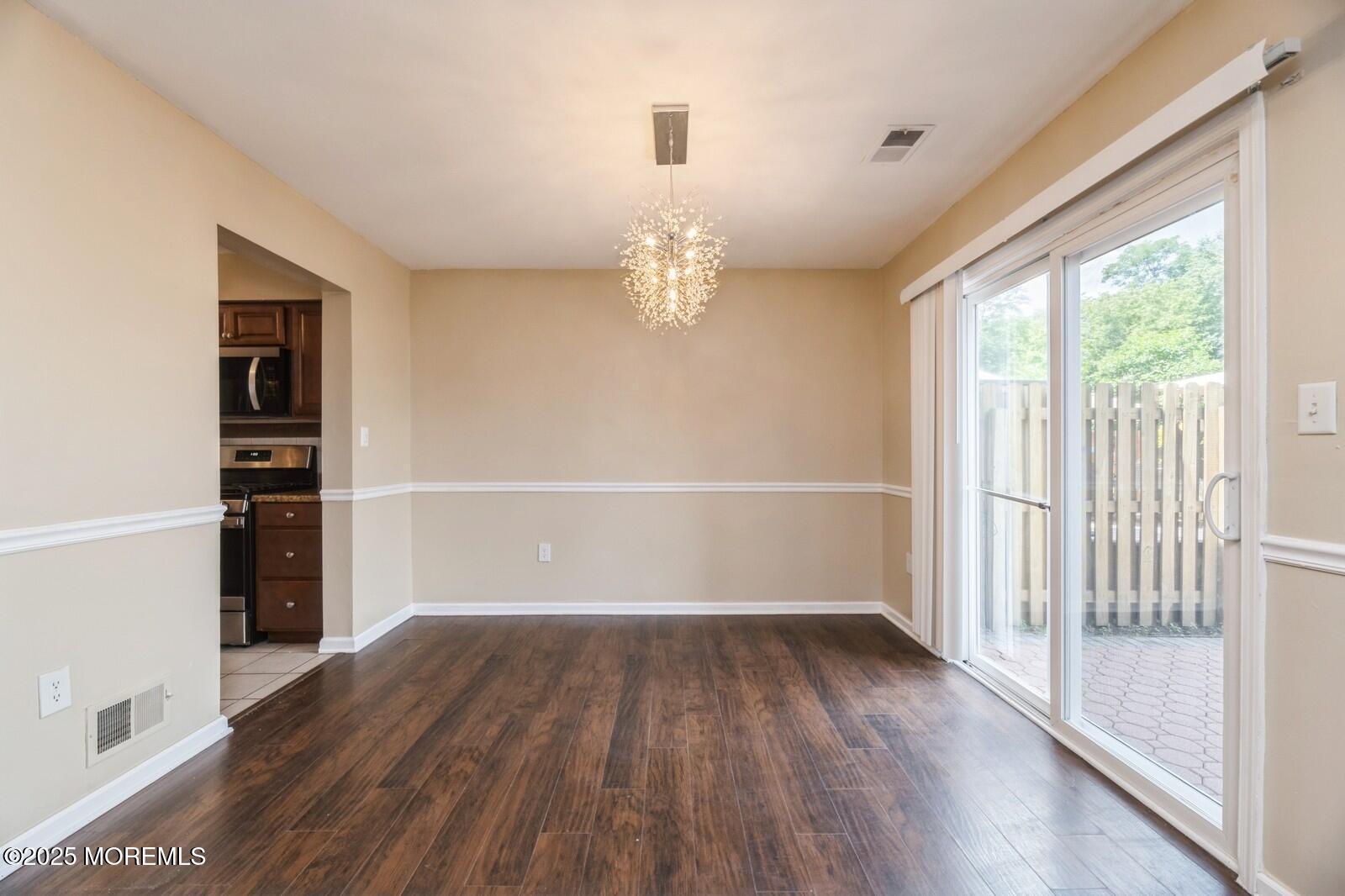 7 Sloop Square Freehold, NJ 07728 - Photo 10 of 30 wooden floor in an empty room with a window