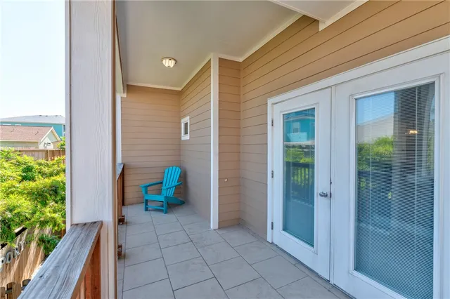 a view of a house with a backyard and furniture