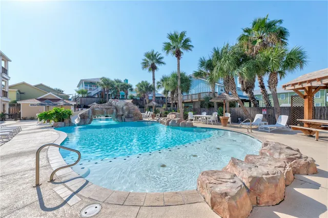 a view of a house with backyard porch and sitting area