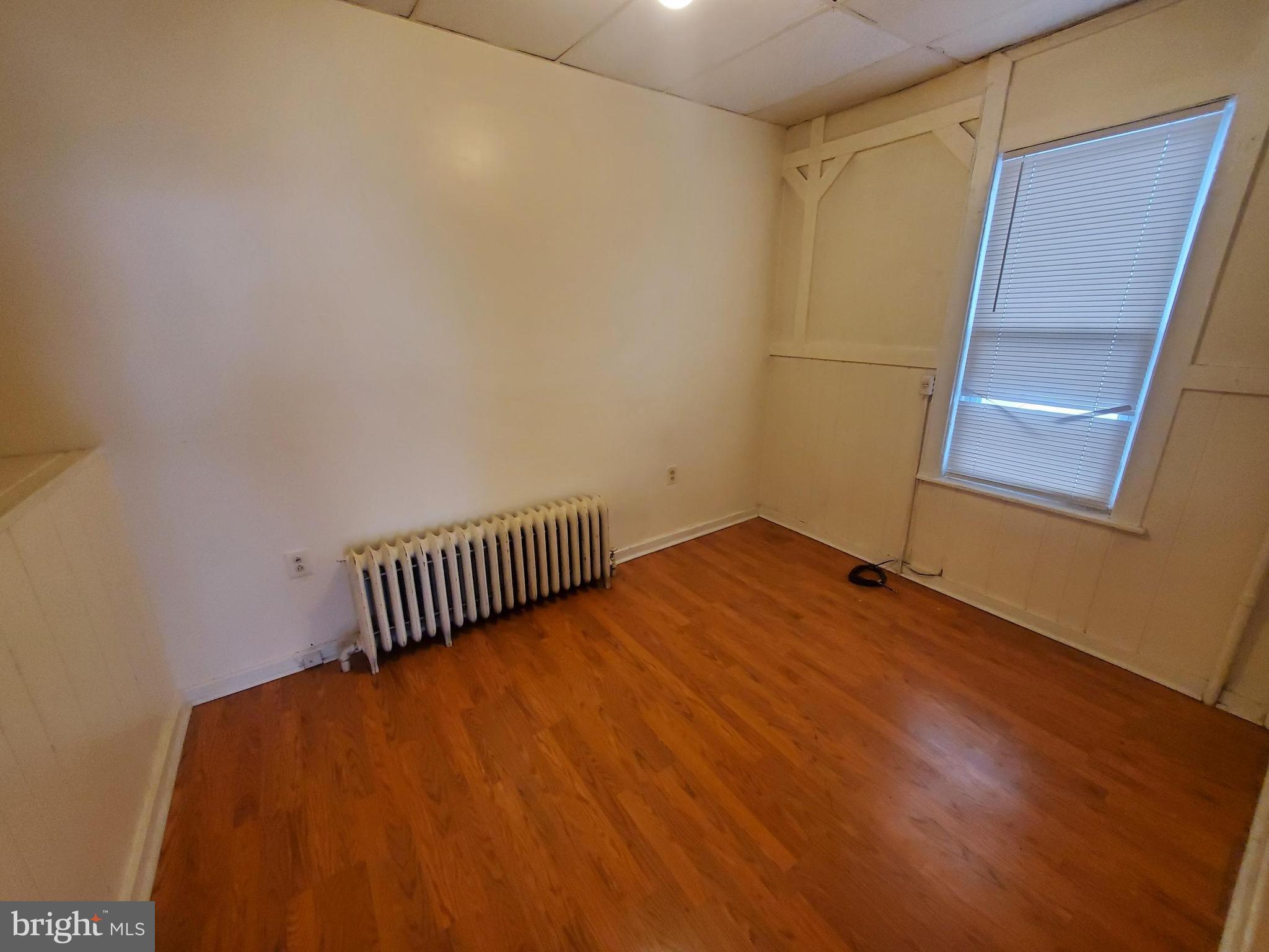 960 North 11th Street, Unit 2A Reading, PA 19604 - Photo 5 of 7 a view of empty room with wooden floor