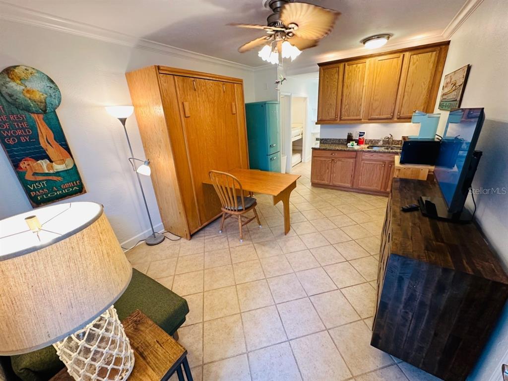 709 Gulf Way, Unit 19 St. Pete Beach, FL 33706 - Photo 12 of 39 a workspace with furniture and a window