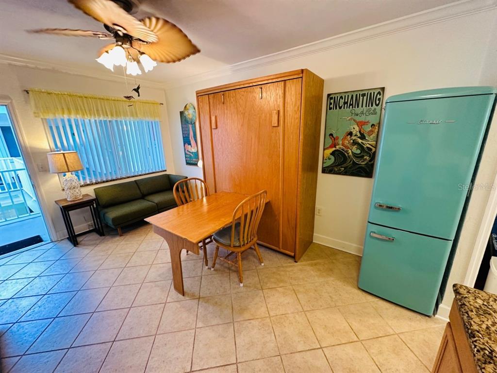 709 Gulf Way, Unit 19 St. Pete Beach, FL 33706 - Photo 15 of 39 a living room with furniture and a window