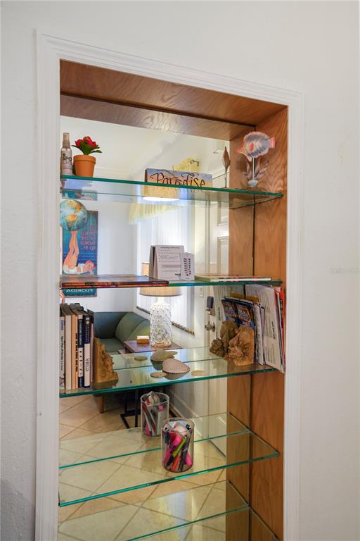 709 Gulf Way, Unit 19 St. Pete Beach, FL 33706 - Photo 35 of 39 a room with storage and a table