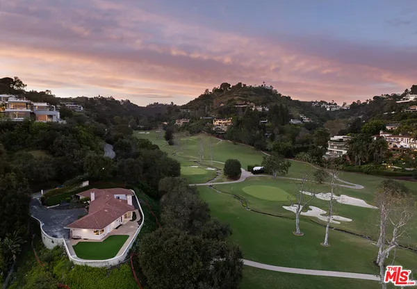 an aerial view of a house with a garden