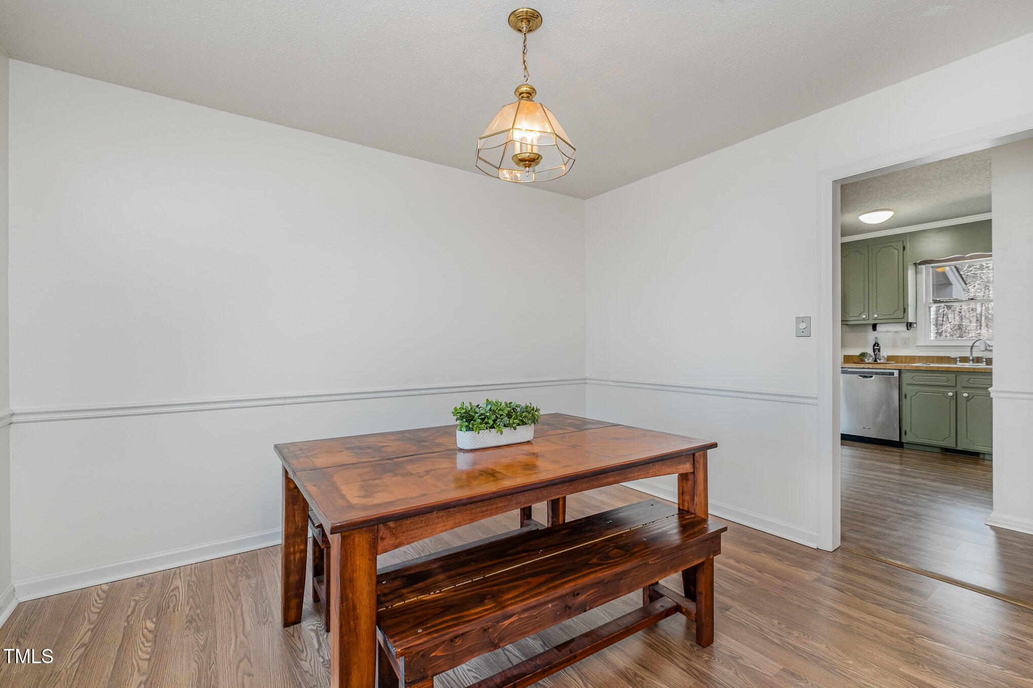 4213 Timberbrook Drive Raleigh, NC 27616 - Photo 11 of 37 a view of a dining room with furniture and wooden floor