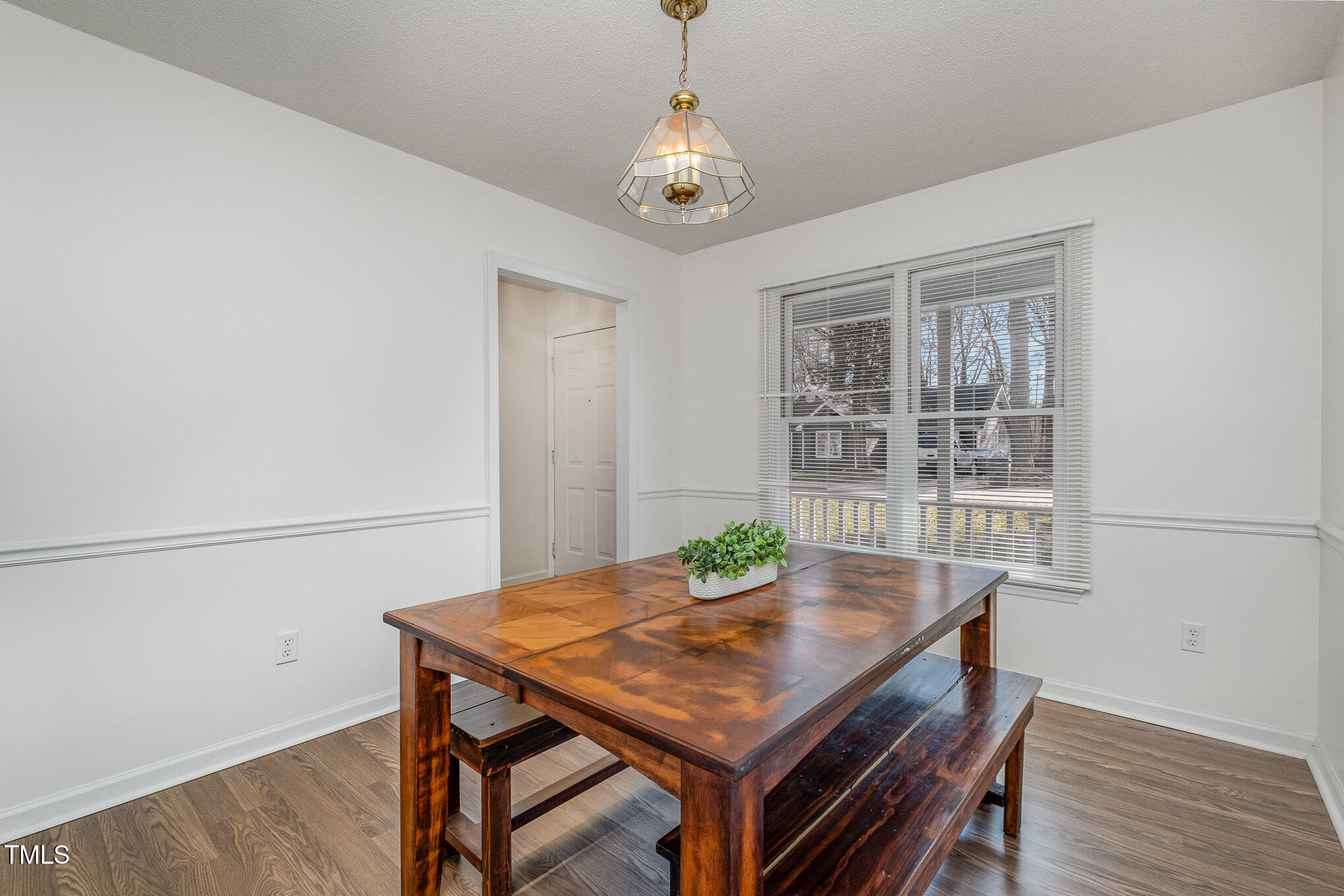 4213 Timberbrook Drive Raleigh, NC 27616 - Photo 12 of 37 a view of a dining room with furniture and wooden floor