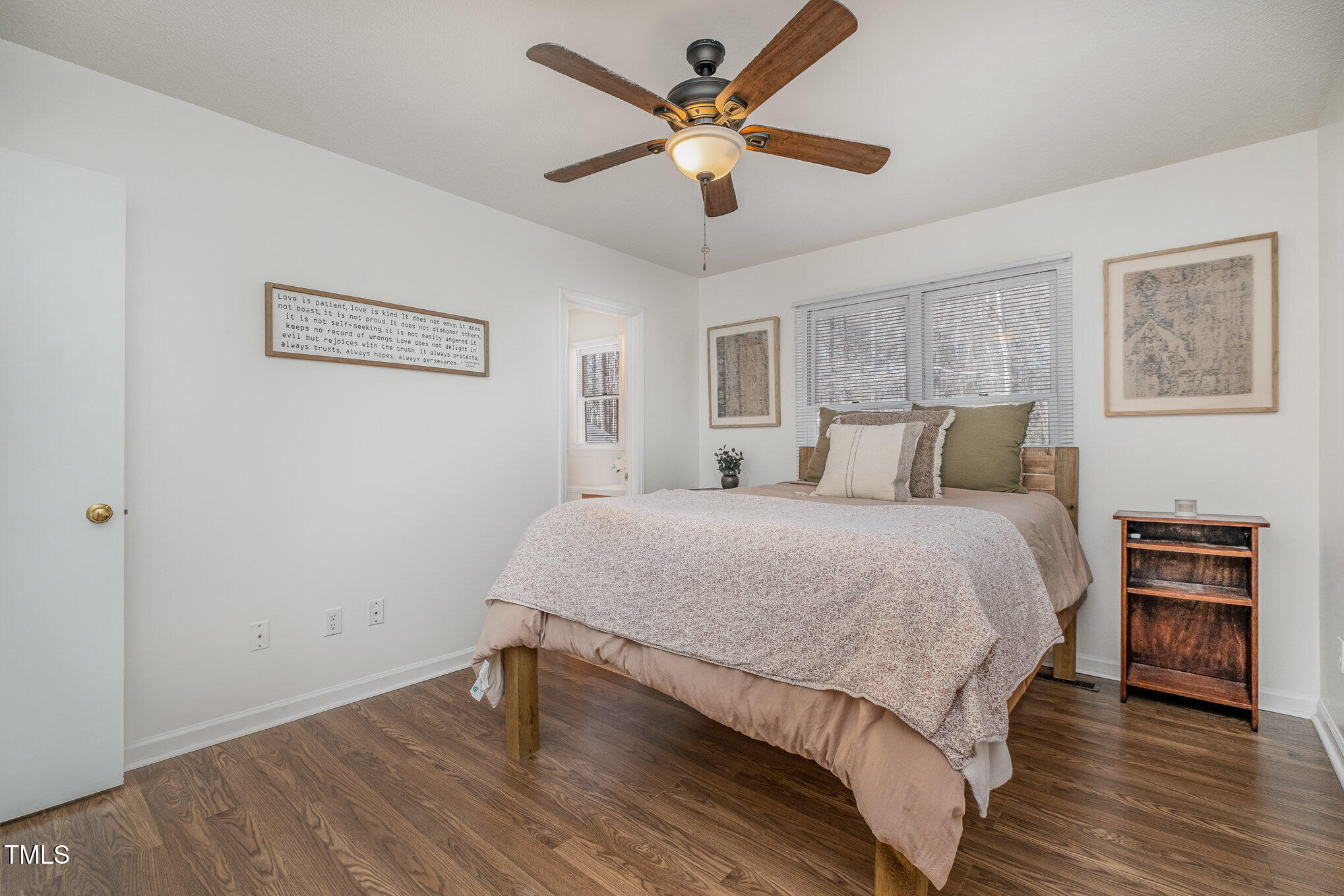 4213 Timberbrook Drive Raleigh, NC 27616 - Photo 13 of 37 a bedroom with a bed and a ceiling fan
