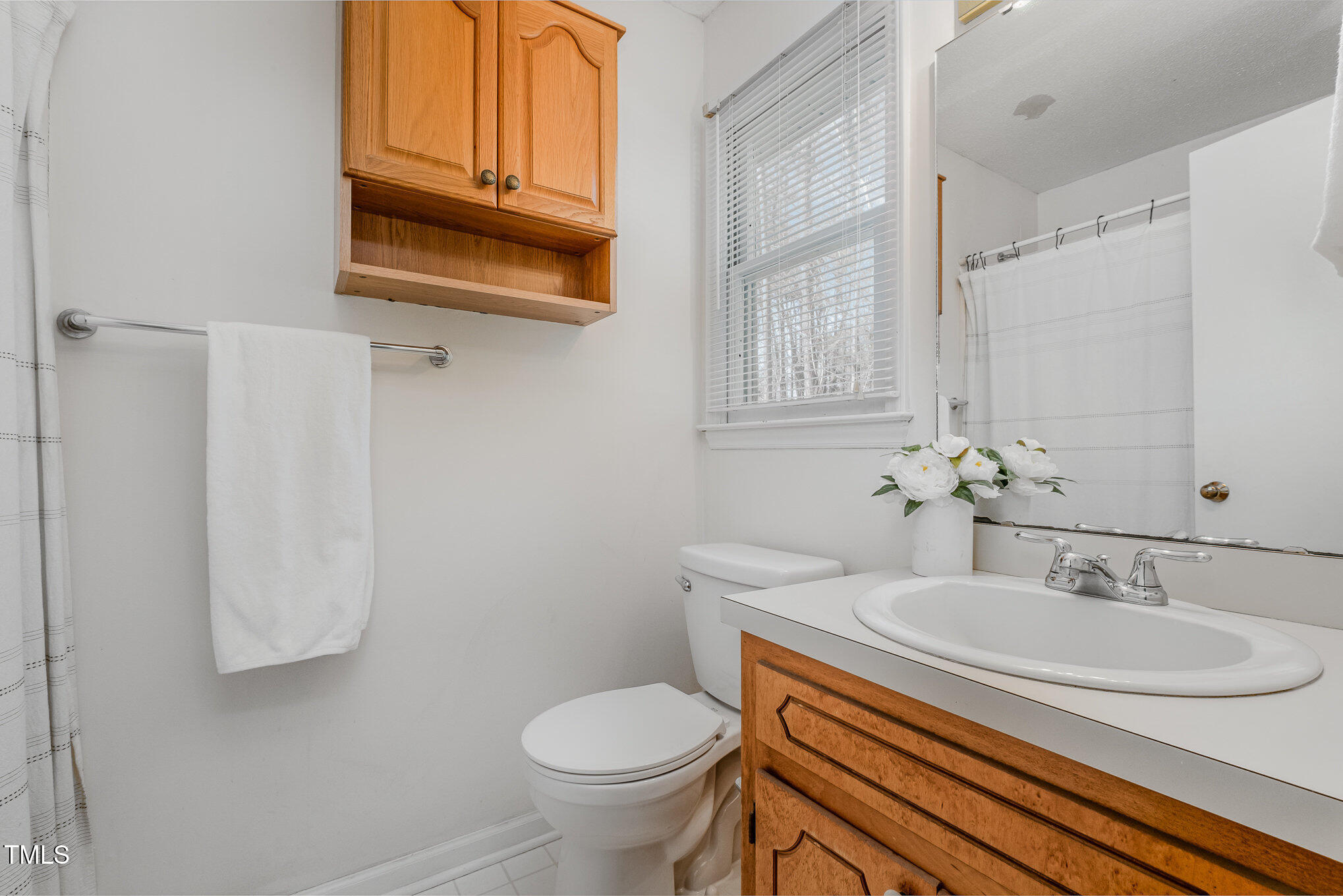 4213 Timberbrook Drive Raleigh, NC 27616 - Photo 15 of 37 a bathroom with a sink toilet and shower