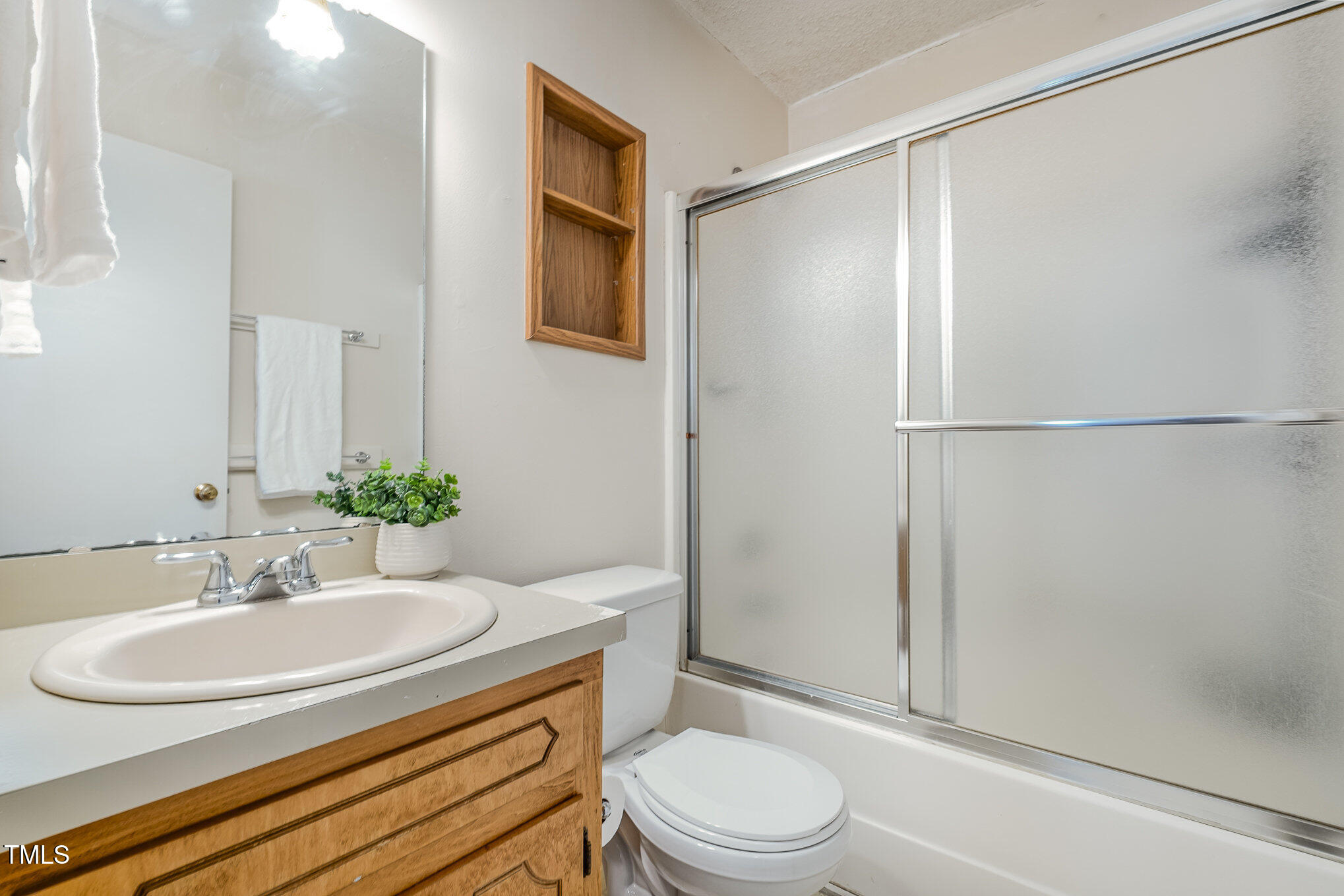 4213 Timberbrook Drive Raleigh, NC 27616 - Photo 20 of 37 a bathroom with a sink toilet and shower