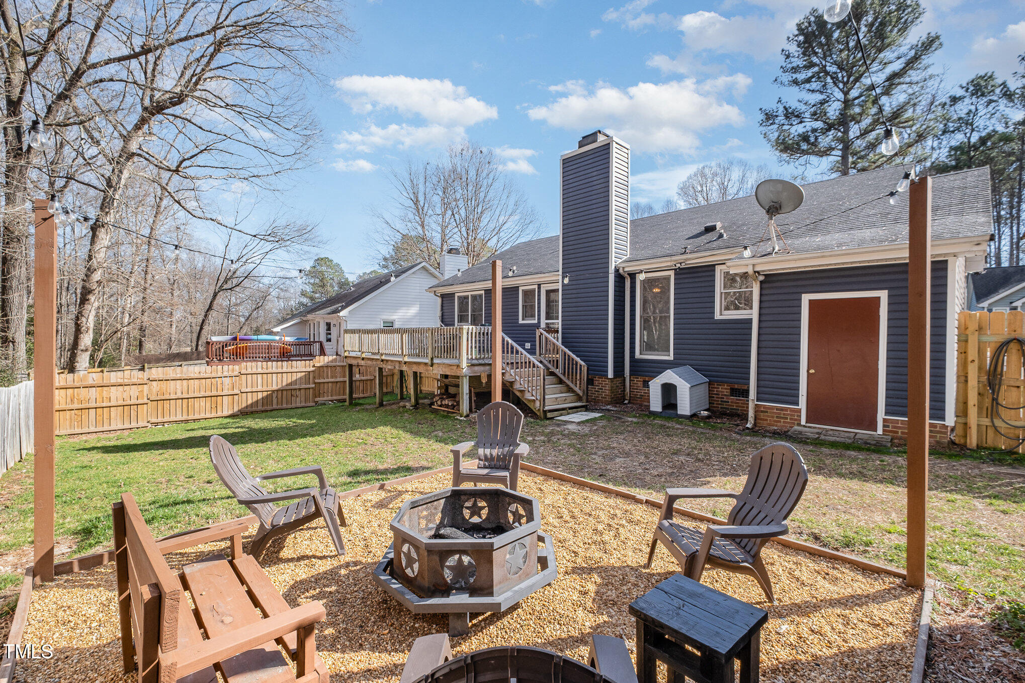4213 Timberbrook Drive Raleigh, NC 27616 - Photo 23 of 37 a view of a patio with table and chairs with wooden fence