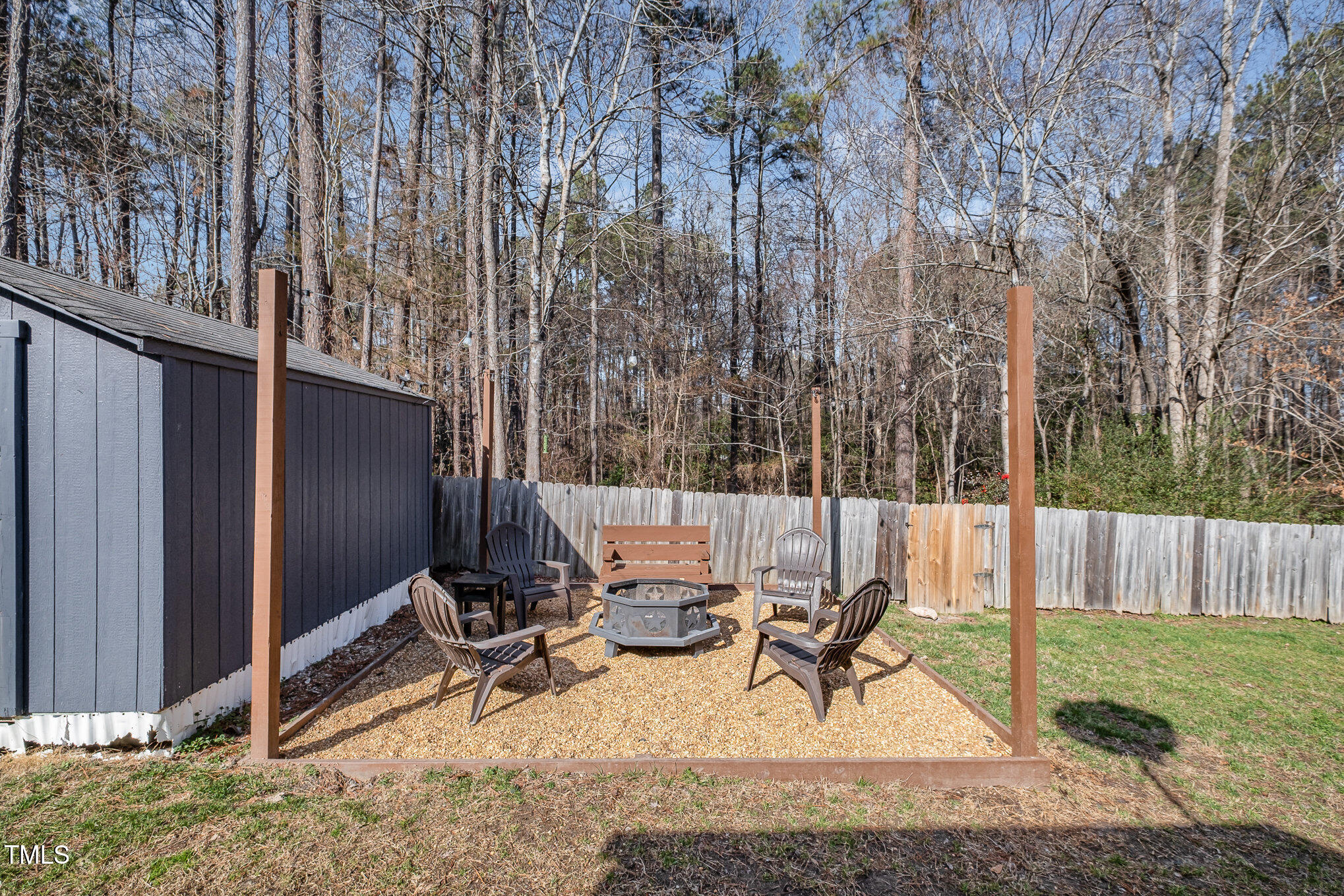4213 Timberbrook Drive Raleigh, NC 27616 - Photo 24 of 37 a view of backyard with a table and chairs