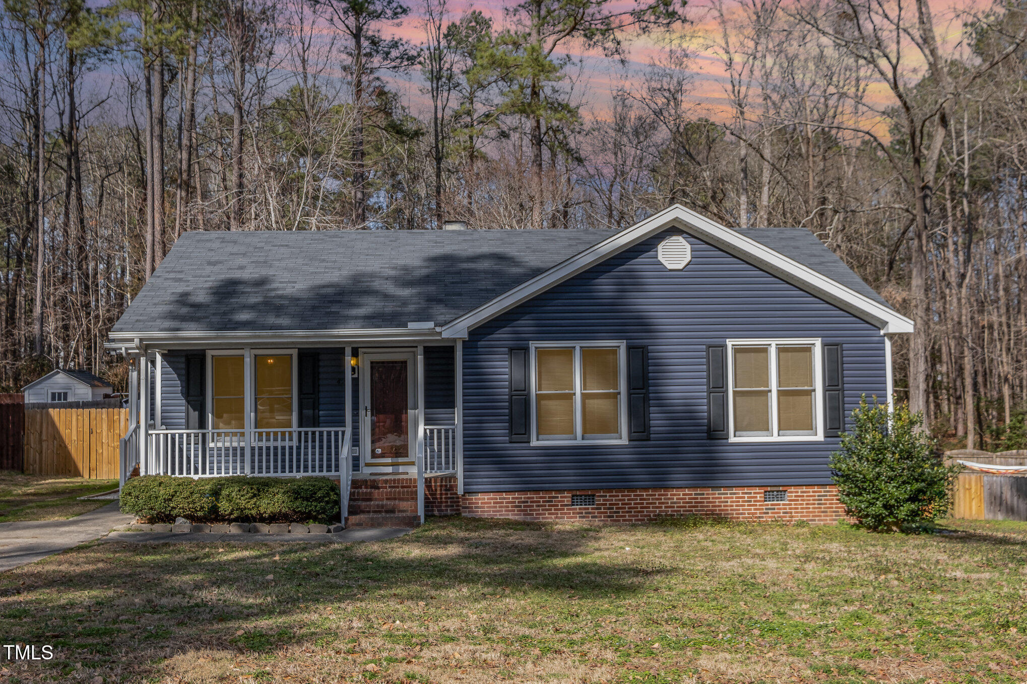 4213 Timberbrook Drive Raleigh, NC 27616 - Photo 2 of 37 a view of a house with a small yard plants and large tree