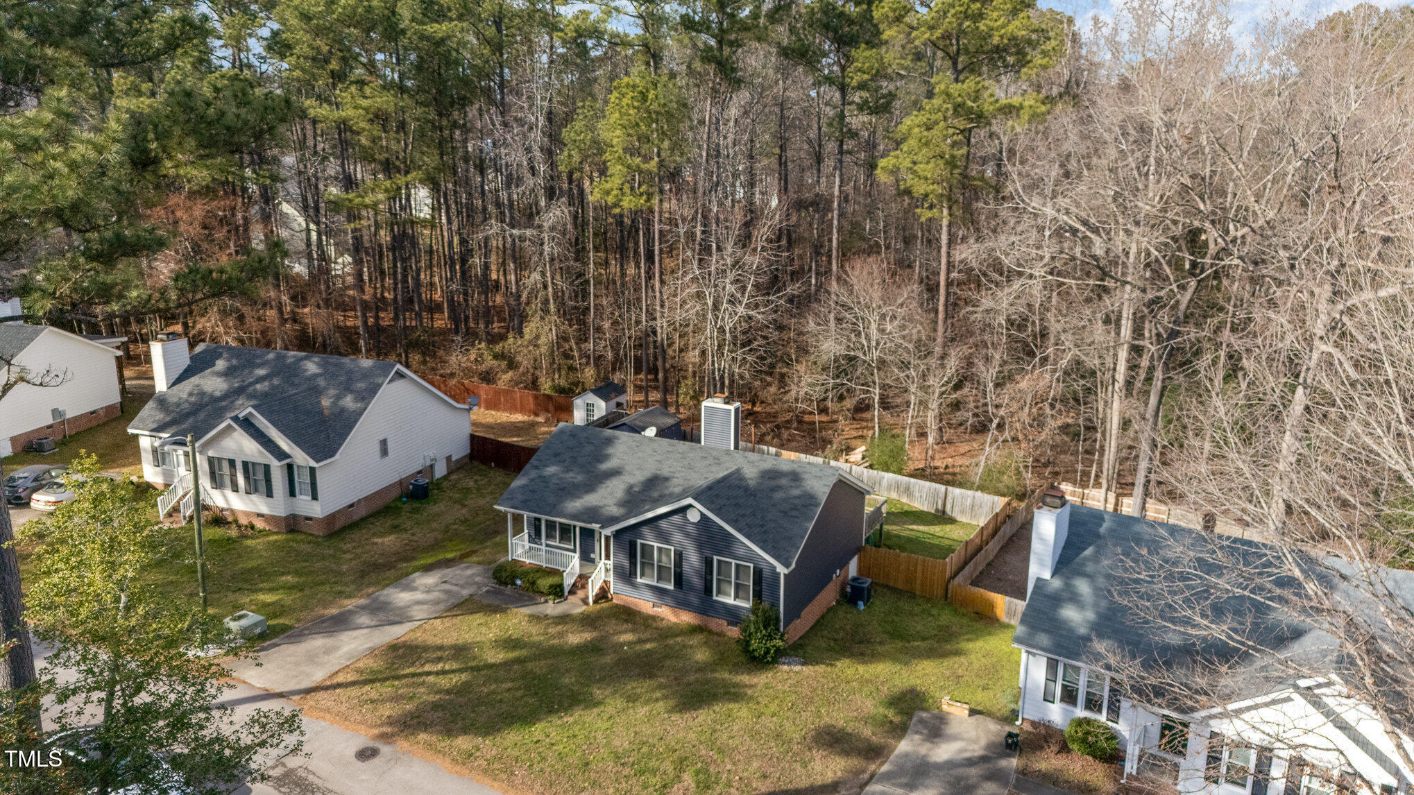 4213 Timberbrook Drive Raleigh, NC 27616 - Photo 31 of 37 an aerial view of a house with swimming pool and large trees