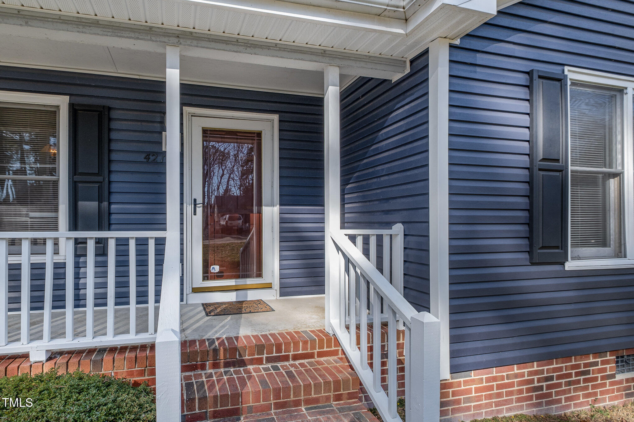 4213 Timberbrook Drive Raleigh, NC 27616 - Photo 3 of 37 a view of a brick house with a large window
